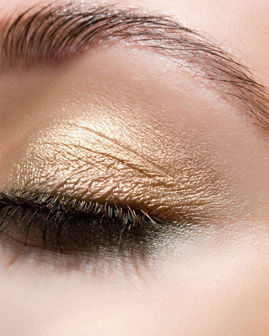 A close-up of eye makeup featuring the Golden eyeshadow shade. The rich, metallic hue adds a striking shimmer, enhancing the eyelid with a bold, radiant glow for a glamorous look.