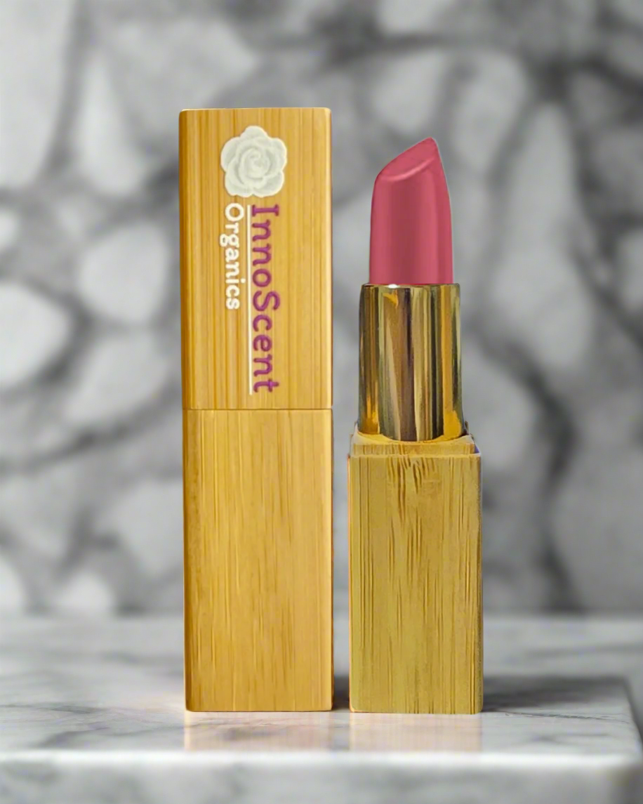 Sweet Rose lipstick in stylish refillable bamboo packaging, beautifully displayed in a modern bathroom setting, highlighting sustainable and elegant beauty.